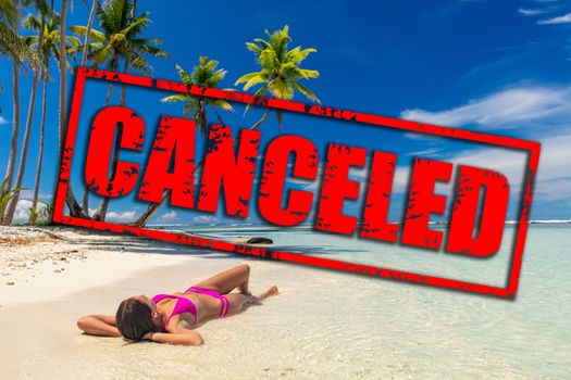 Travel vacation and flight canceled because of coronavirus travel ban. Corona virus crisis in airline and travel industry. Canceled red stamp text on beach woman relaxing lying down on holidays.