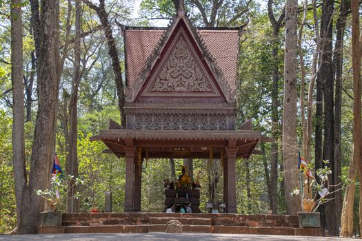 Cambodia, Angkor Thom - March 2016: Ancient Buddha statues have been re-covered with decorative roofs and are still used by the local population as place as worship within the Angkor Thom complex