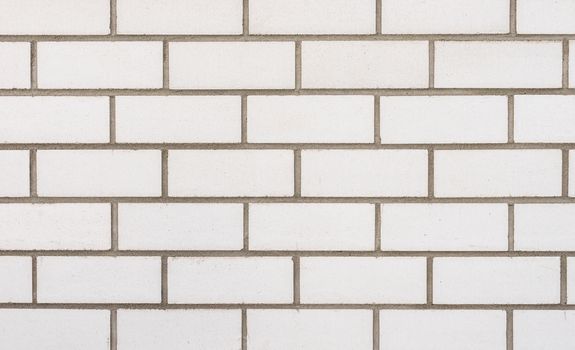 Background texture of white brick wall, close-up
