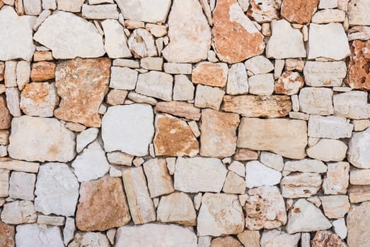 Background of natural stone wall texture, structure close-up