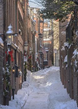USA, Boston - January 2018 - Boston
Street in the snow with the American flag flying
