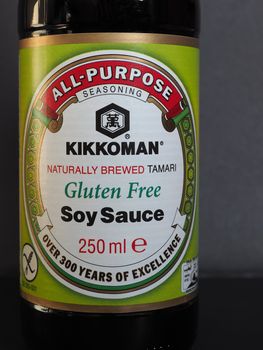 TOKYO, JAPAN - CIRCA JANUARY 2020: Kikkoman naturally brewed tamari gluten free soy sauce bottle