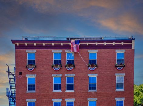 American Flag and Bunting on Old Brick Building