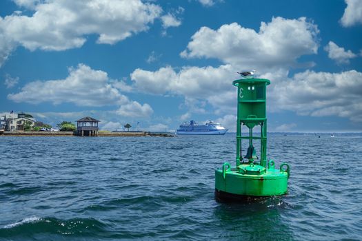 Green Channel Marker near cruise ship docked in Newport Rhode Island