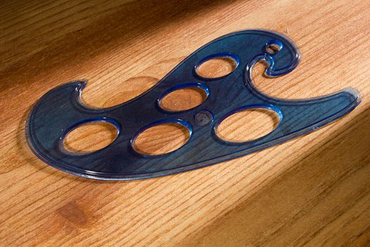 Plastic blue pattern on a wooden table