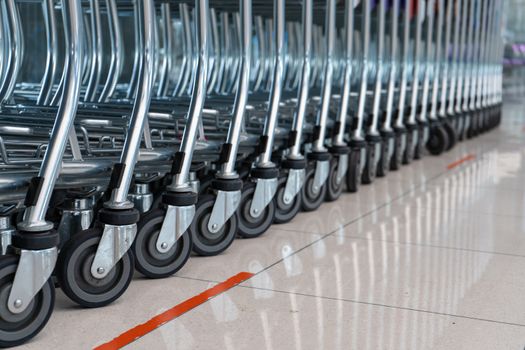 A row of carts in a supermarket. Carts for luggage