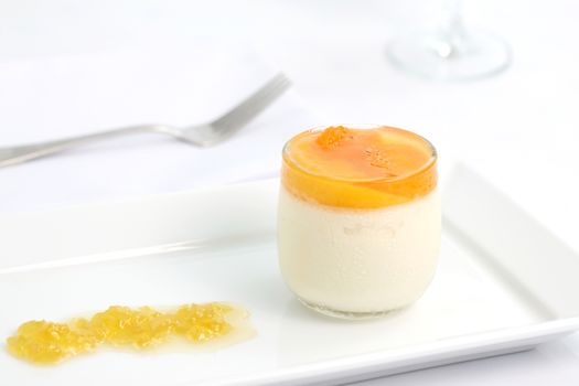 Orange panna cotta isolated in white background