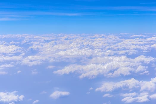 Blue sky background with white clouds on sunny day.