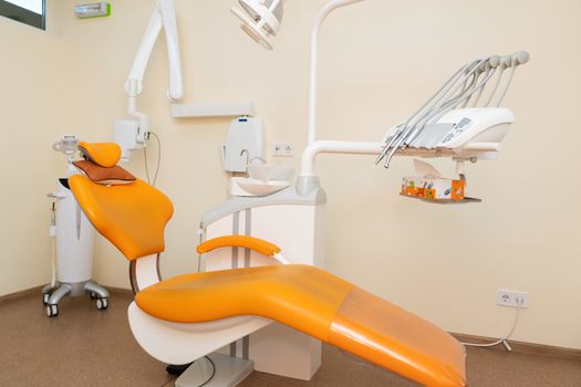 Interior stylish modern dentist office in orange style