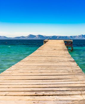 View of wooden pier at the bay of Alcudia on Mallorca, Spain Balearic islands
