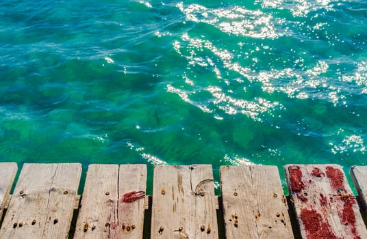 Soft sea wave water and wooden pier background