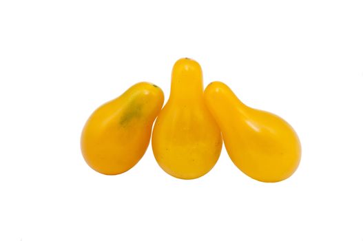 three yellow tomatoes isolated on white background