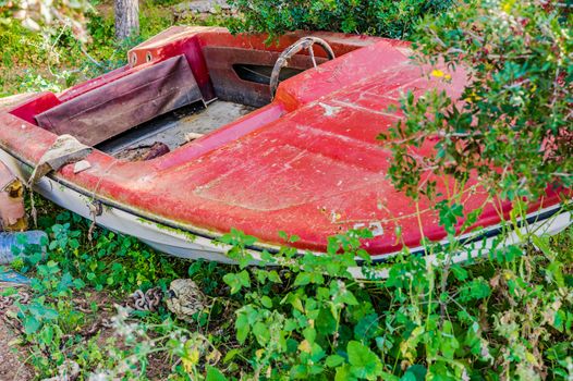 Grunge red ancient motorboat
