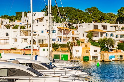 Anchored boats in mediterranean marina of Cala Dor, Majorca island, Spain
