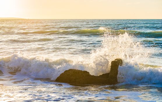 View of wavy seascape with beautiful light