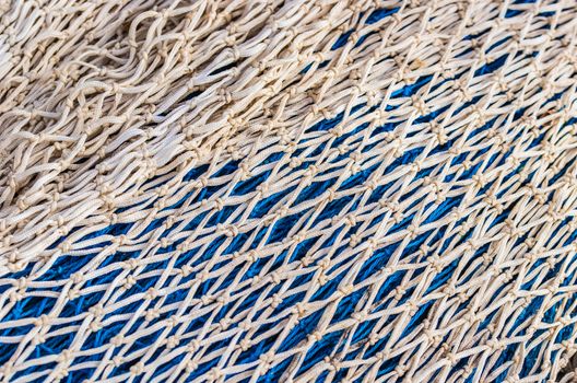 Close-up of maritime gray and blue fish net pattern texture