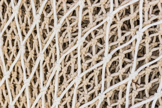 Close-up of commercial fishing net at harbor