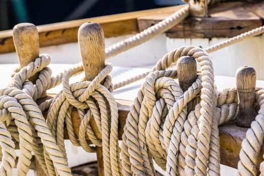 Old sailboat, detail closeup of wooden cleats 