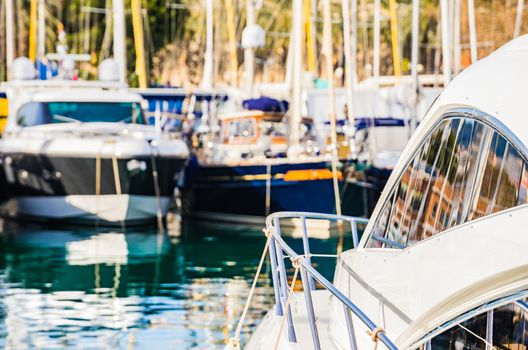 View of moored luxury yachts boats at mediterranean sea harbor on Majorca island, Spain