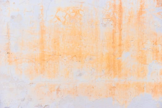 Vintage colored wall background with rustic weathered plaster texture 