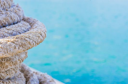 Close-up of fishing rope at harbor, maritime background texture