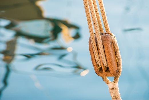 Sailing boat pulley, block and tackle with moored nautical rope