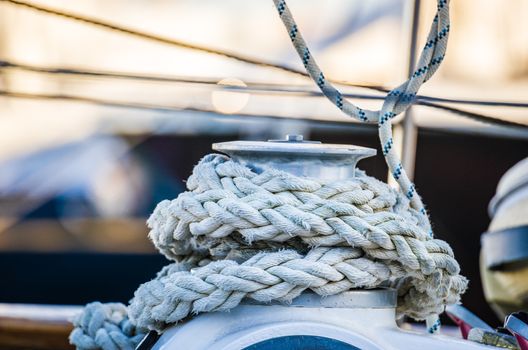 Close-up of winch and rope, sailing yacht detail view on boat deck on sailing yacht