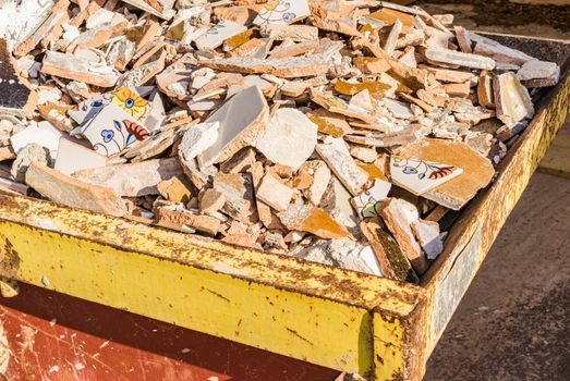 Heap of old demolished tiles of construction waste
