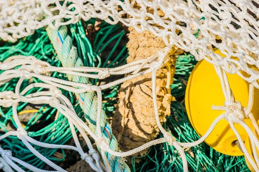 Close-up of fish net and buoy heap, maritime background texture