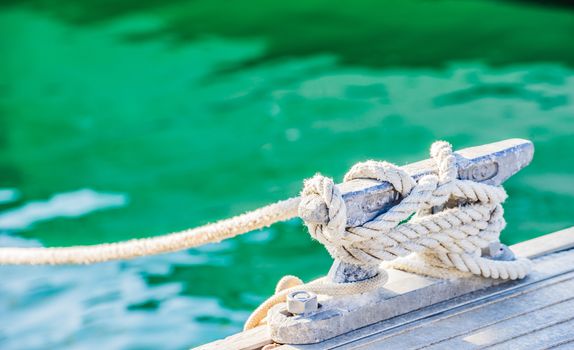 Detail image of tied knot of nautical rope on cleat