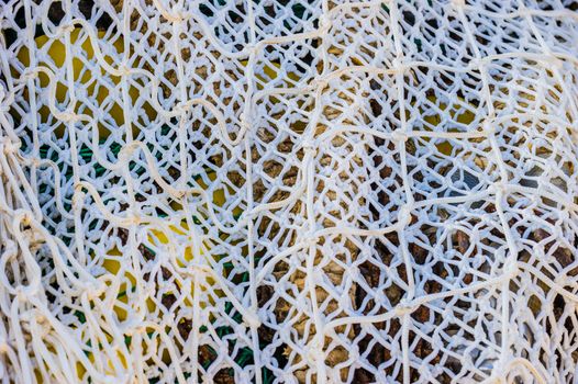 Close-up of commercial fishing net at harbor