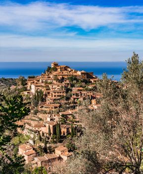 Spain Mallorca, view of the historic village of Deia with beautiful mediterranean landscape

