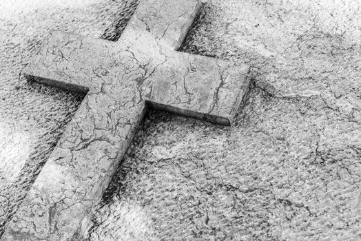 Cemetery tombstone with stone cross background