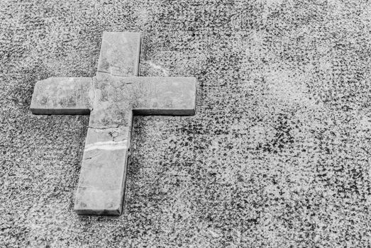 Gray tombstone with stone cross, dead grief background with copy space