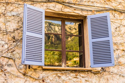 Mediterranean window shutters and wall background