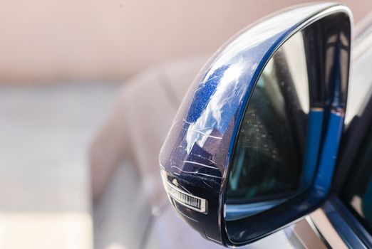Damaged car side-view mirror after crash

