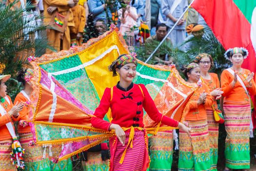 Thoet Thai, Chiang Rai - THAILAND, December 12, 2018 : Group of Shan or Tai Yai (ethnic group living in parts of Myanmar and Thailand) in tribal dress do native dancing in Shan New Year celebrations.