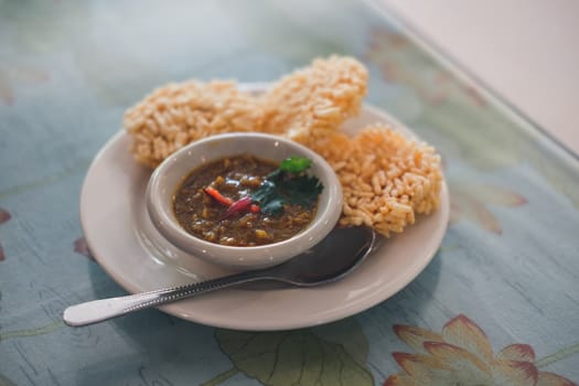 Crispy rice cake and pork and shrimp dipping. traditional  Thai snack food appetizer