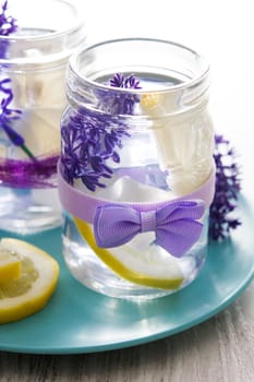 Lavender lemonade drink on white wooden table