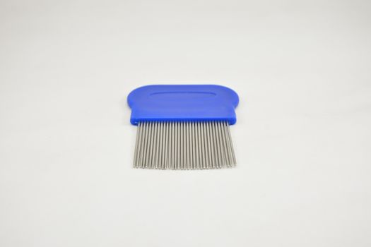 Lice comb stainless steel tooth blue handle use to remove nits and lice on hair