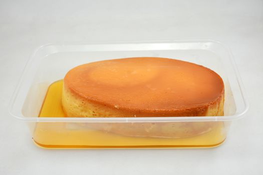 Leche flan Filipino delicacy placed in flat tub made in the Philippines