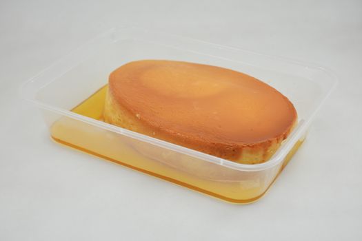 Leche flan Filipino delicacy placed in flat tub made in the Philippines