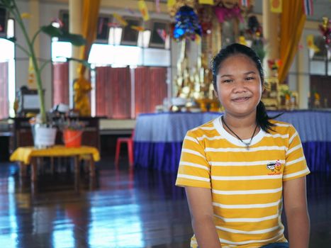 The girls wear yellow stripes. On a blurred background.