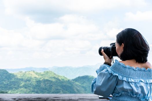 Tourists taking photo of natural scenery