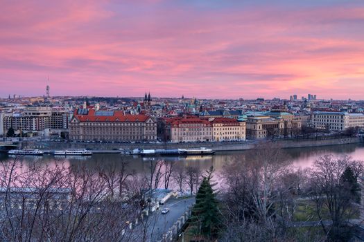 Sunset looking down on historic bridges over the river in Prague