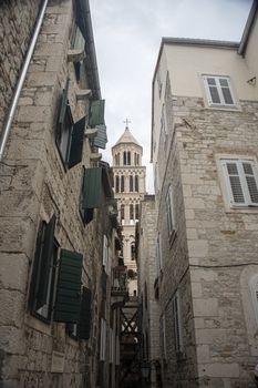 Croatia, Split - June 2018: View of the Cathedral tower though the narrow streets of the town