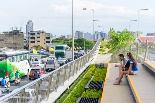 Bangkok , Thailand - 1 July, 2020: People walking and sitting in relax at Chao Phraya Sky Park  landmark in Bangkok