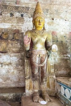 Dambulla, Sri Lanka, Aug 2015: Buddha statue standing in the cave temples at Dambulla