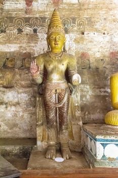Dambulla, Sri Lanka, Aug 2015: Buddha statue standing in the cave temples at Dambulla
