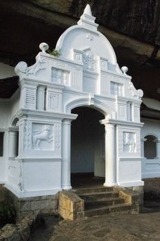 Dambulla, Sri Lanka, Aug 2015: White facades providing access to the cave temples high in the mountain at Dambulla
